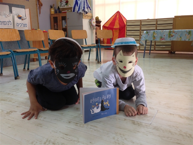 2 boys from Gan Sigaliyot in Petach-Tikva dressed as cats, following activity on A Tale of Two Cats
